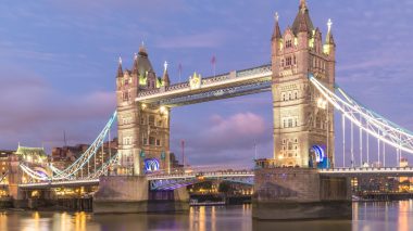 A low angle shot of the famous historic Tower Bridge in London during evening time